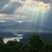 Sunrays Lake Chatuge Benita Esposito 9446-2 Dramatic sunbeams breaking through storm clouds over Lake Chatuge and the Blue Ridge Mountains.