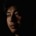 Portrait of a highly sensitive Christian man emerging from shadow into light, symbolizing emotional healing, profound forgiveness, and inner peace.