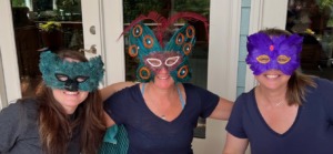 3 women wearing masks at an HSP Retreat to symbolize the people-pleasing image they project to try to get their needs met