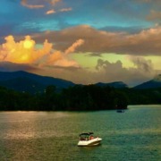 Sunset over Lake Chatuge and the Blue Ridge Mountains with a rainbow, the serene venue for Krista's HSP Retreat.