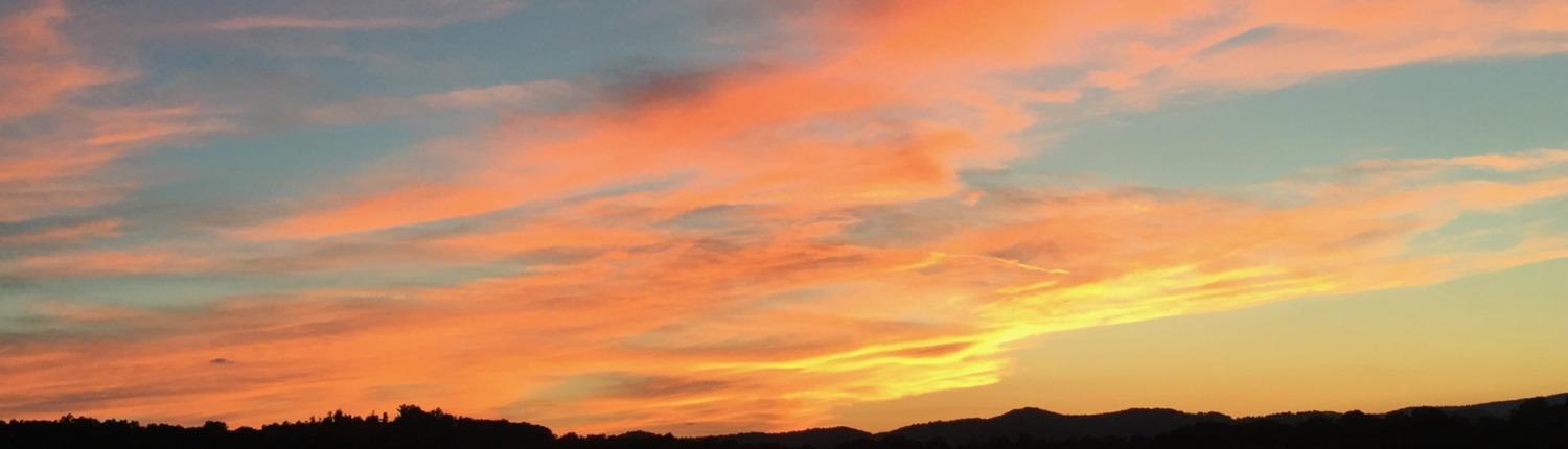 A stunning turquoise and peach sunset captured by Benita A. Esposito, symbolizing hope, healing, and a peaceful spiritual awakening for highly sensitive introverts.