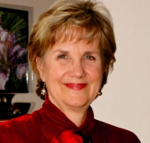 Professional headshot of licensed psychotherapist and spiritual counselor Benita Esposito, smiling warmly.