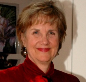 Professional headshot of licensed psychotherapist and spiritual counselor Benita Esposito, smiling warmly.