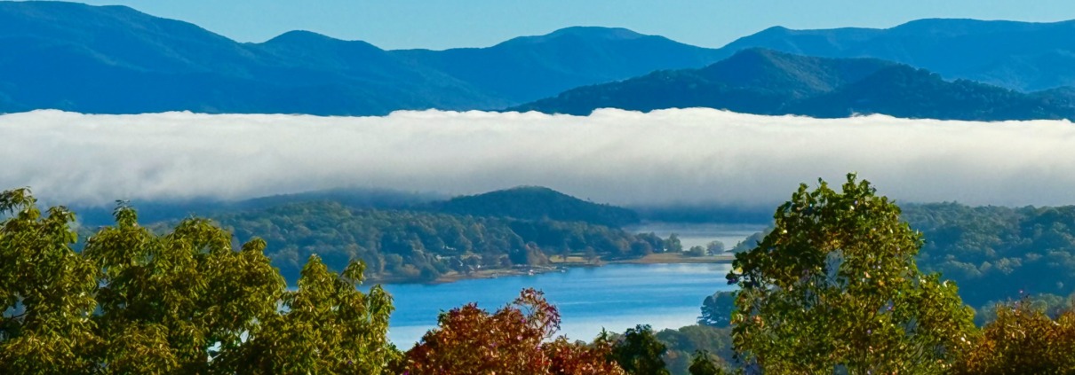 Panoramic view of white low-lying cloud over Lake Chatuge and the Blue Ridge Mountains in Young Harris, Georgia.