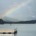 A vibrant rainbow breaking through storm clouds over Lake Chatuge in Young Harris, Georgia.