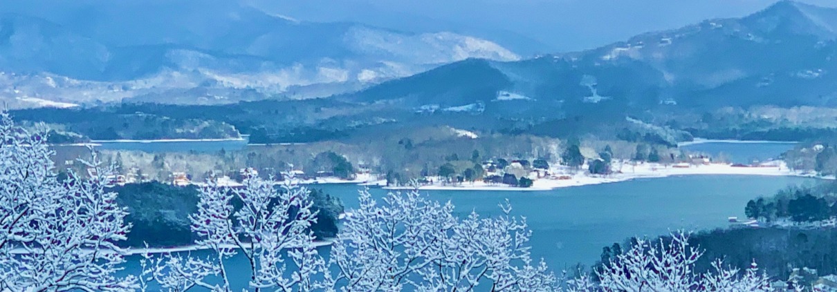 Snow-covered Blue Ridge Mountains and branches overlooking Lake Chatuge, the venue for Ellen's HSP Retreat.