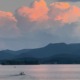 Sunset over Lake Chatuge in NC and GA, featuring peach clouds over the Blue Ridge Mountains, venue of our HSP Retreats.