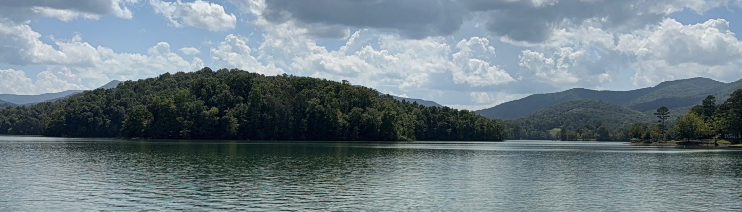 Lake Chatuge and Blue Ridge Mountains of GA, the peaceful setting for Anthony's HSP Retreat transformation.
