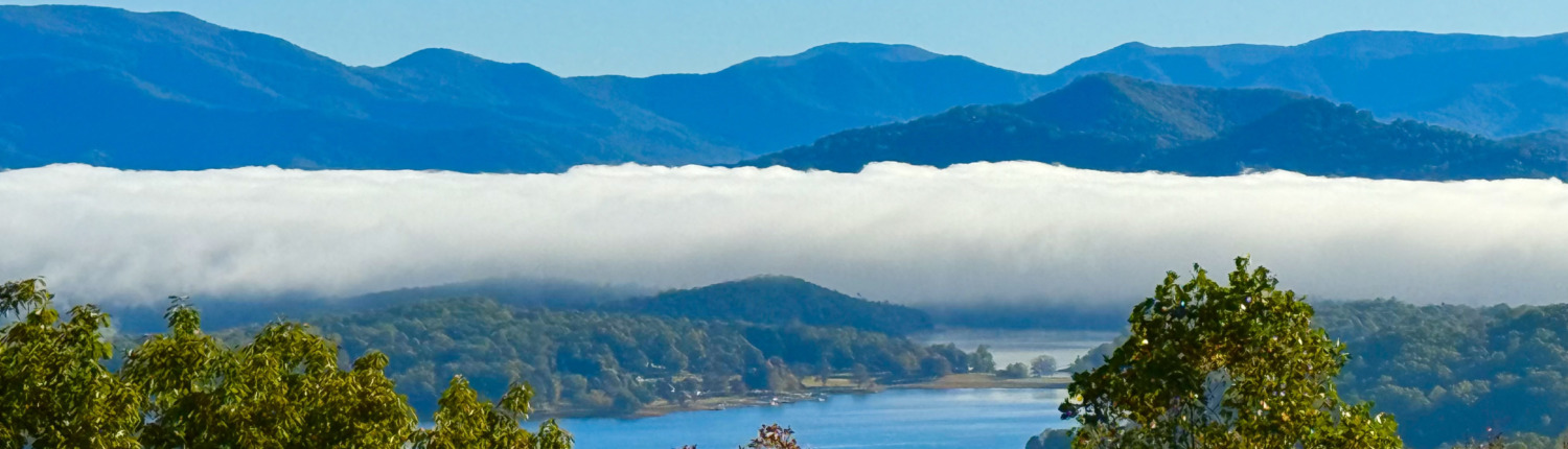 White clouds blanketing Lake Chatuge in Young Harris, Georgia, the serene home and venue for Helen's HSP Retreat.