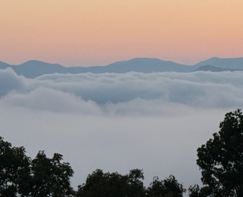 Scenic morning clouds over the Blue Ridge Mountains during a highly sensitive person (HSP) retreat.
