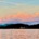 A wide panoramic sunset over the rolling, layered Blue Ridge Mountains, with dark tree silhouettes in the foreground and a soft peach and orange sky reflecting on a distant lake valley.